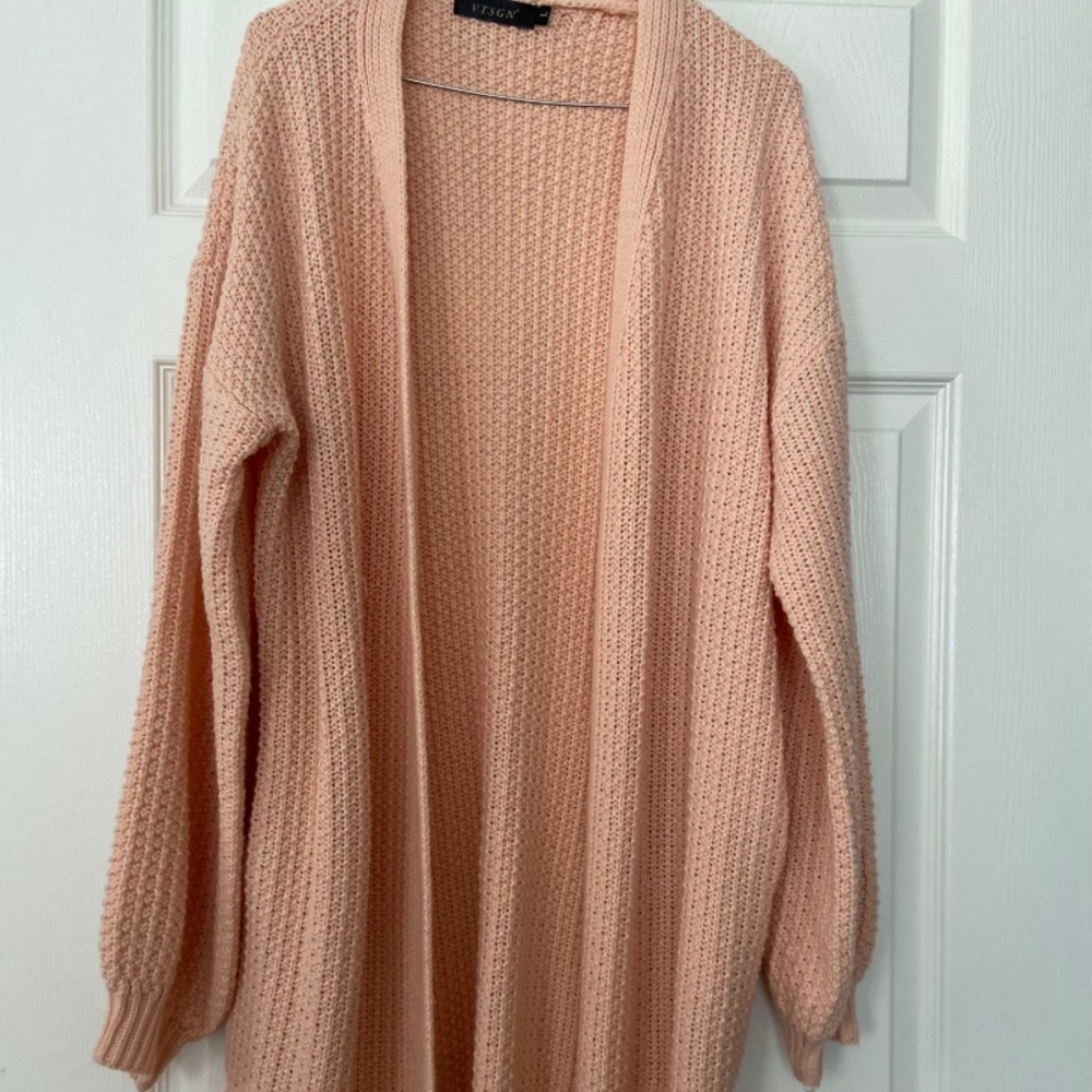 Brand new women’s size large peach colored cardigan